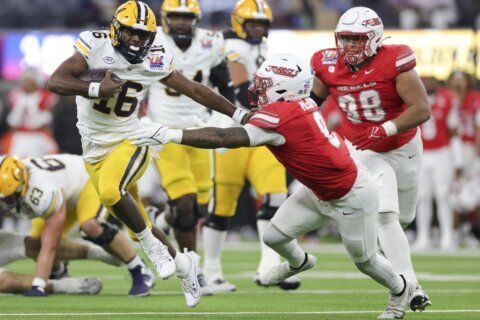 Hajj-Malik Williams throws 2 TDs passes to help No. 24 UNLV beat Cal 24-13 in the LA Bowl