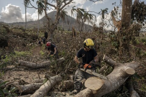 Macron met with anger and frustration over cyclone response during French leader’s visit to Mayotte