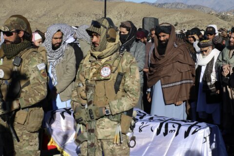 Thousands attend the funeral of a Taliban minister killed by an Islamic State suicide bomber