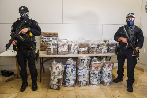 Australian police arrest 13 people and seize a record 2.3 tons of cocaine from a fishing boat