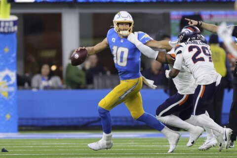 Justin Herbert passes for 2 touchdowns, Chargers score on free kick and rally past Broncos 34-27