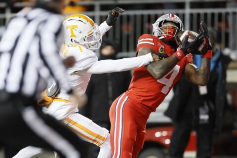 Howard throws 2 TD passes to Smith to help Ohio State rout 42-17 in College Football Playoff