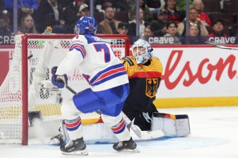 Cole Hutson has 5 assists, defending champion US routs Germany 10-4 in world junior hockey opener