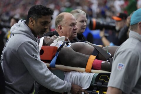 Miami WR DuBose taken off the field on a stretcher after hit to the head against Texans