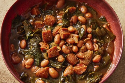 Flavorful chorizo brings meaty depth to a paprika pinto bean soup with collard greens