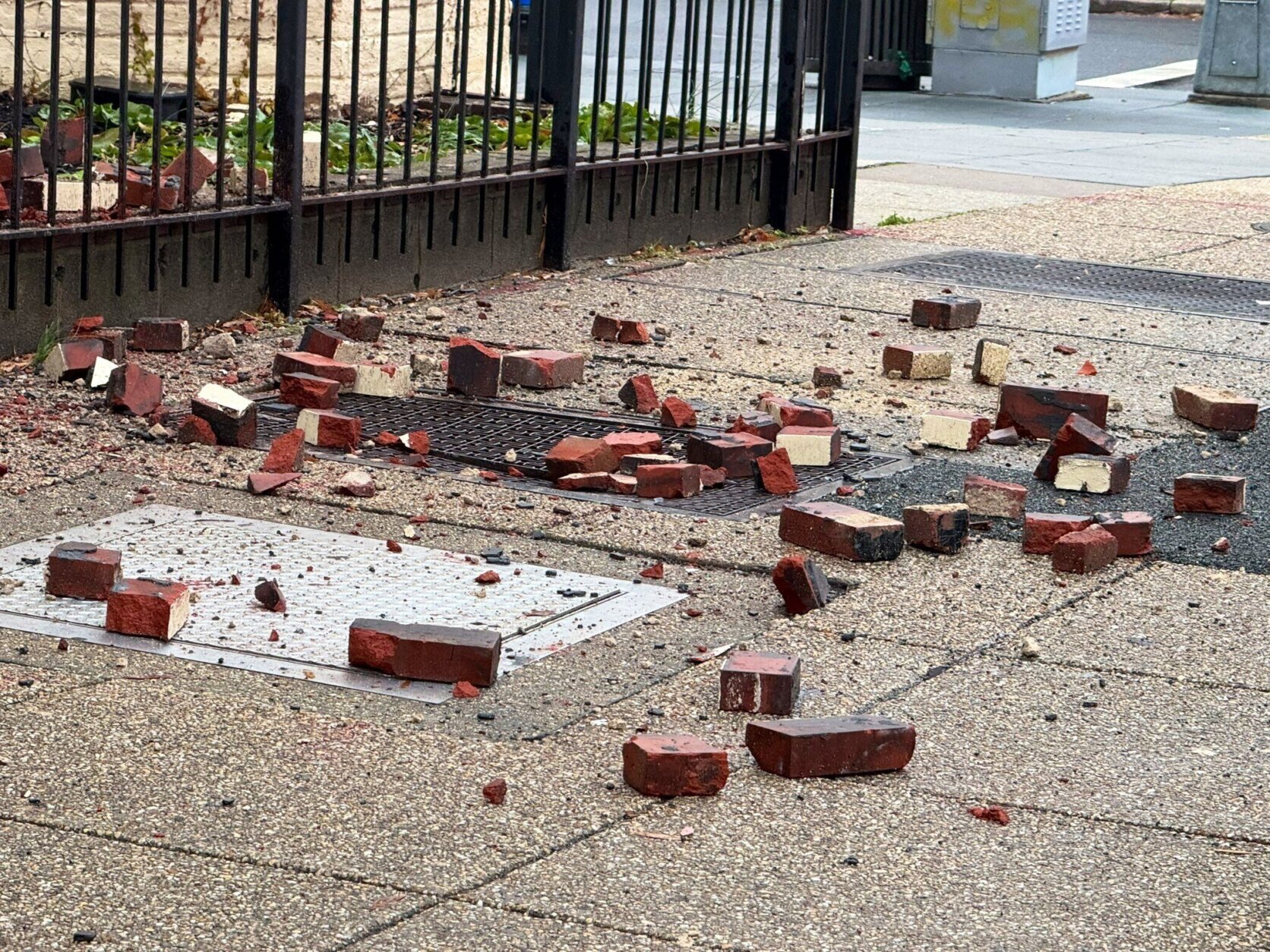 Bricks scattered on the sidewalk