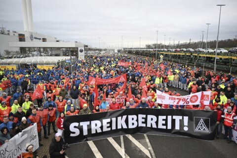 Volkswagen workers hold 2-hour strikes to push back against proposed pay cuts and plant closures