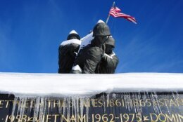 Snow covers the Marine Corps War Memorial in Arlington, Virginia on December 20, 2009. The Washington, DC  area was hammered December 19 by a fierce snowstorm that dumped more than a foot (38.48cm) of snow. AFP PHOTO/Karen BLEIER        (Photo credit should read KAREN BLEIER/AFP via Getty Images)