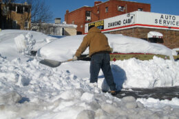 A man shovels snow at a cab  hub in North West Washington, DC on February 11, 2010. A blizzard on February 10, 2010 turned the 2009-2010 winter into the snowiest ever on record for the Washington area with millions trapped at home, many without power, and the federal government shut down for the fourth day in a row. Washington's public transportation system was still only providing limited service with only a few bus routes operating.  AFP PHOTO  Eva HAMBACH (Photo credit should read EVA HAMBACH/AFP via Getty Images)