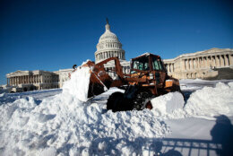 WASHINGTON - FEBRUARY 11:  A worker of the Architect of the Capitol removes snow with a front-end loader on the ground of the U.S. Capitol February 11, 2010 in Washington, DC. Washingtonians had to dig out again after the region was hard hit by a second mega snowstorm in five days making 2009 � 2010 the snowiest winter since the record has been kept in 1870.  (Photo by Alex Wong/Getty Images)