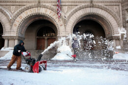 WASHINGTON - FEBRUARY 11:  A worker plows snow outside the Old Post Office on Pennsylvania Avenue following yesterday�s snowstorm February 11, 2010 in Washington, DC. Washingtonians had to dig out again after the region was hard hit by a second mega snowstorm in five days making 2009 - 2010 the snowiest winter since the record has been kept in 1870.  (Photo by Alex Wong/Getty Images)