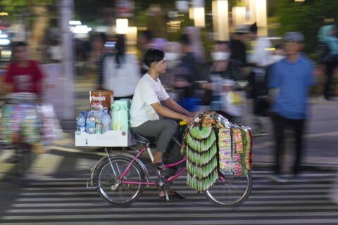 AP PHOTOS: Starlings, Indonesia’s bicycle coffee sellers, peddle the streets of Jakarta