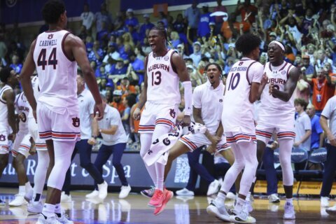 Kansas holds off Auburn for No. 1 in AP Top 25 as SEC grabs 3 of top 4 spots; UConn slides to No. 25