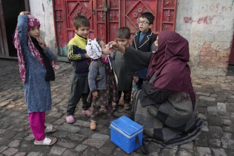 Roadside bomb kills 3 police officers escorting polio workers in northwest Pakistan