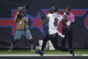 Lamar Jackson breaks NFL QB rushing record, accounts for 3 TDs in Ravens' 31-2 romp over Texans