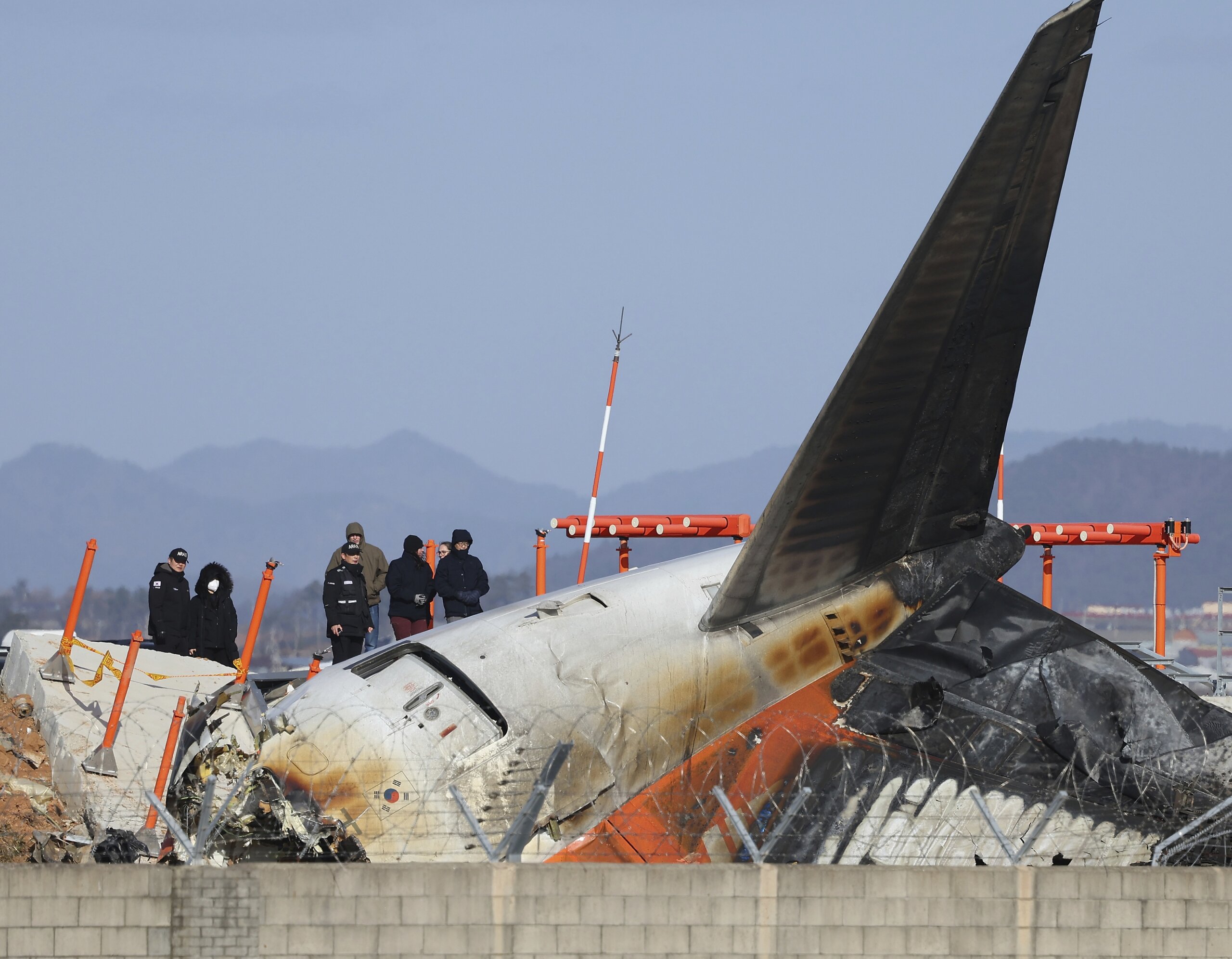 US and Boeing investigators examine the site of a deadly South Korean 