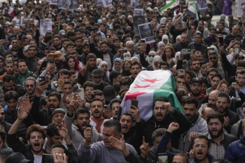 Funeral for activist turns into call for justice for other missing Syrians