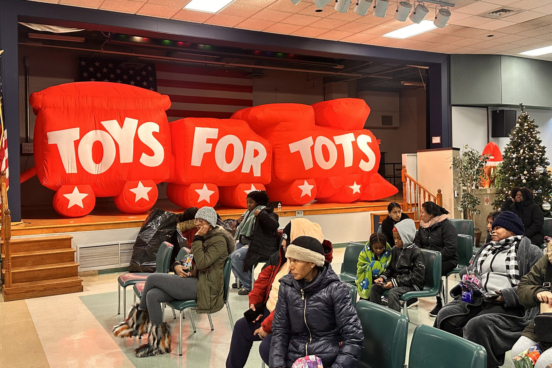 People waiting inside at a Toys For Tots event in Landover, Md.