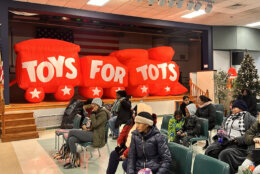 People waiting inside at a Toys For Tots event in Landover, Md.