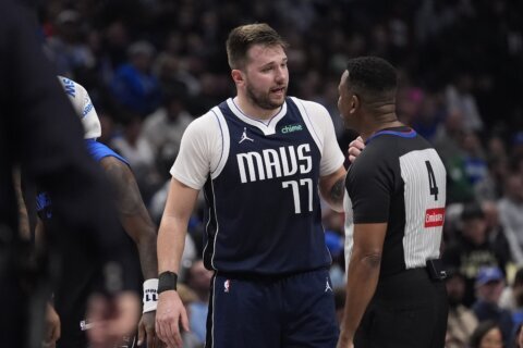 Mavs star Luka Doncic will be out about a month before check on calf injury, AP source says