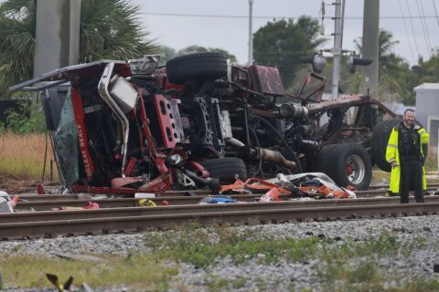 Train collides with fire truck in Florida. Police say 3 firefighters and at least 12 passengers hurt