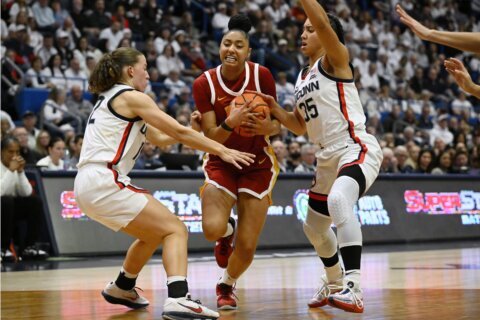 JuJu Watkins and No. 7 USC hold off Paige Bueckers and fourth-ranked UConn 72-70