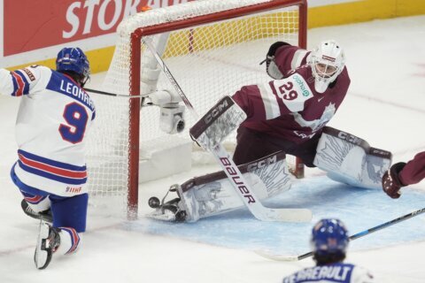 Notre Dame’s Danny Nelson scores twice, defending champ US beats Latvia 5-1 in world junior hockey