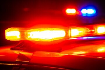 Police lights on first responder vehicles at crime scene.