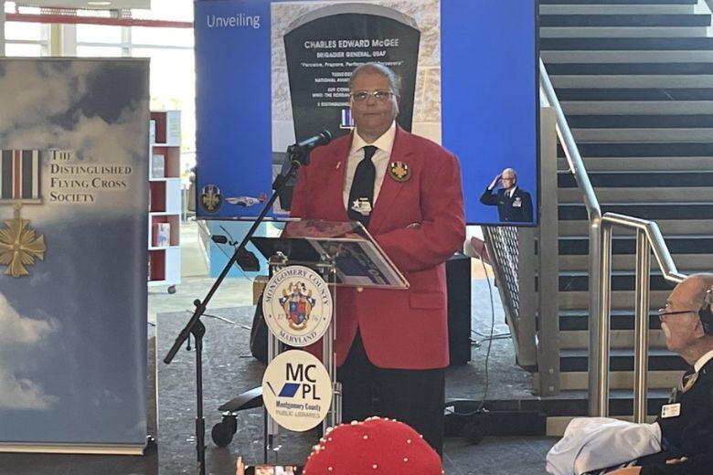 Yvonne McGee speaks at a ceremony to dedicate a memorial to her father, Charles, a dedicated Tuskegee Airman.