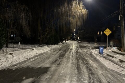 In Virginia, crews work to make neighborhood streets ‘passable’ instead of clear