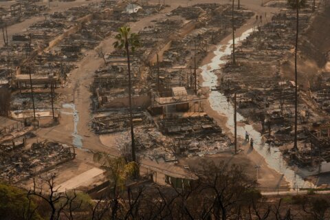 LA area’s 2 biggest blazes burn at least 10,000 structures, while new fire leads to more evacuations