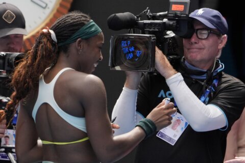 Coco Gauff writes ‘RIP TikTok USA’ on a TV camera at the Australian Open