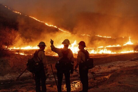 Wildfires latest: 10 confirmed dead as firefighters work to contain blazes in Los Angeles area