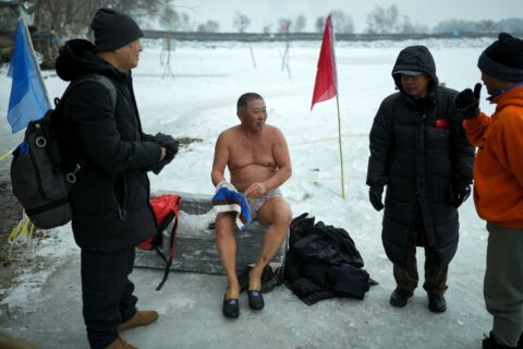 In freezing temperatures, swimmers in China plunge into a river for health and joy