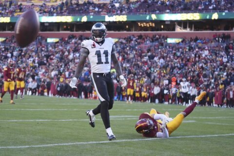 Turning the page: Eagles receiver A.J. Brown reads inspirational book on sideline during playoff win