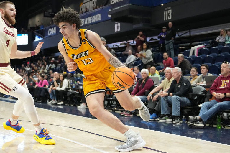 Tyler Tejada of the Towson Tigers with basketball.