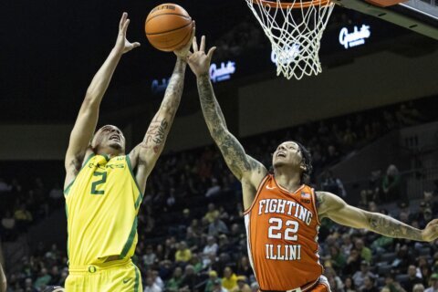 White leads No. 22 Illinois to 109-77 blowout at No. 9 Oregon