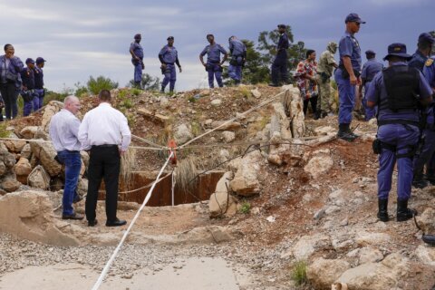 At least 100 illegal miners have died while trapped in a South African mine for months, group says