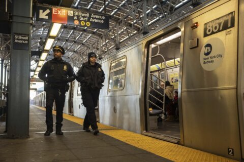 Man pushed onto NYC subway tracks recovering while suspect is charged with attempted murder