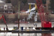 Salvage crews remove large portion of commercial jet from river after deadly air collision near DC