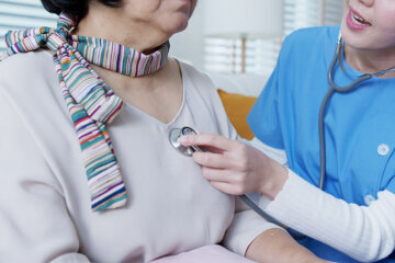 Nurse caring for a patient.