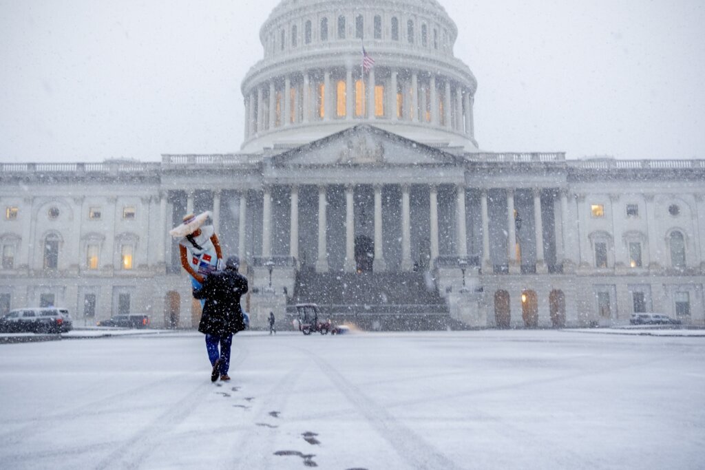 DC area braces for winter storm that could blanket the region with 10 inches of snow, plus freezing rain