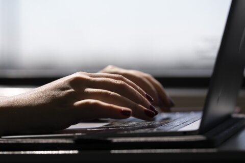 Hands on a computer keyboard
