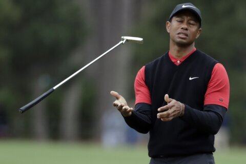 Tiger Woods says he ruptured his Achilles tendon, an injury that will keep him out of the Masters