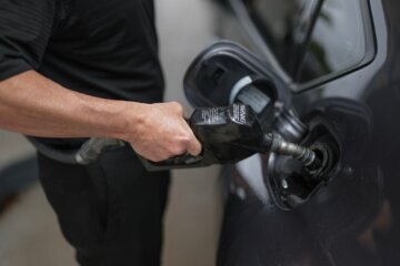 A customer pumps gas into their vehicle at a Shell station on April 10 in Miami, Florida.