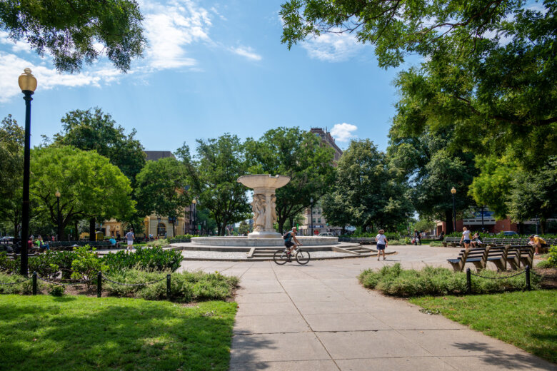 People enjoying a summer day at Dupont Circle, a public park in Washington DC