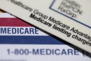 Medicare Advantage PPO card resting on top of a Medicare card