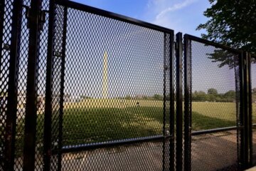 The Washington Monument behind security fencing