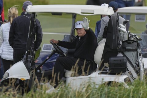 Trump plays golf in Scotland while protesters take to the streets and decry his visit