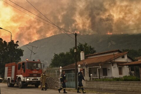 A major forest fire in Greece forces several villages to evacuate